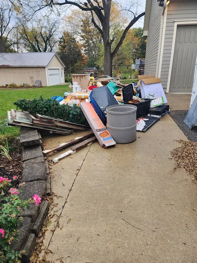 Dumpster being loaded with debris for Commercial Dumpster Rental in Brookfield